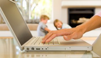 mom at computer Hands of woman typing on laptop computer